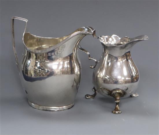 A George III silver cream jug, London, 1801 and an earlier silver tripod cream jug.